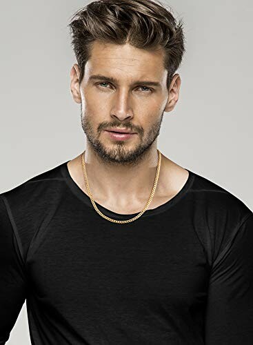 Man wearing a black shirt and gold chain necklace